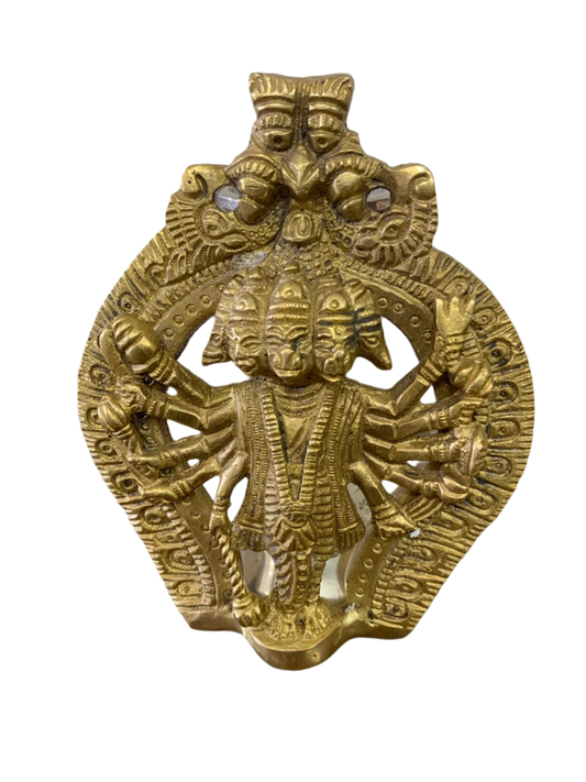 Gold-colored metal deity figurine with multiple arms 